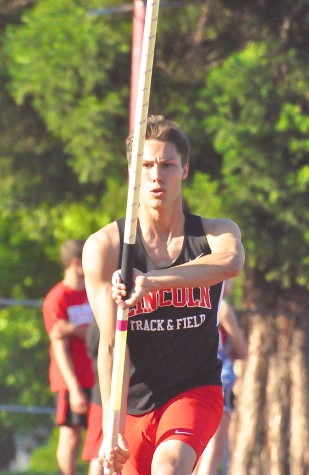 Trevor Cheadle competes in pole vault.