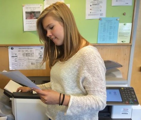 Senior Pascale Rich retrieves a document she sent to the library for printing via Google Clound.