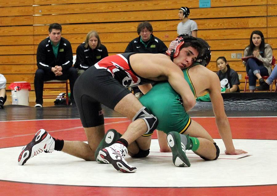 Dylan+Jones+prepares+to+take+down+his+Cleveland+opponent+in+the+126+lb.+weight+class.+Jones+won+by+a+pin.