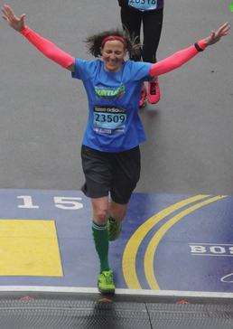 Maureen Kenny crosses the finish line of the Boston Marathon in three hours and 49 minutes. 
Photo by Marathon Photo