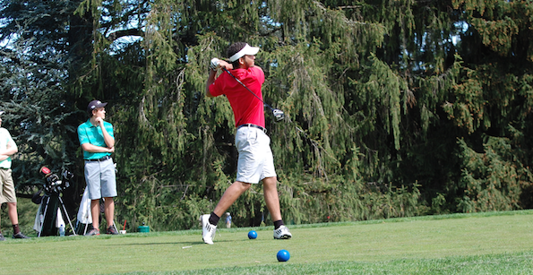 Junior Jonah Pemberton hits his opening drive at a tournament at Portland Golf Club.