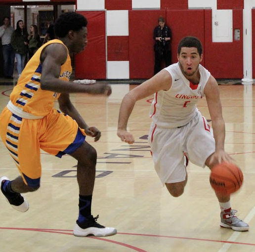 Junior Jonah Pemberton drives in towards the basket in a game against Jefferson.