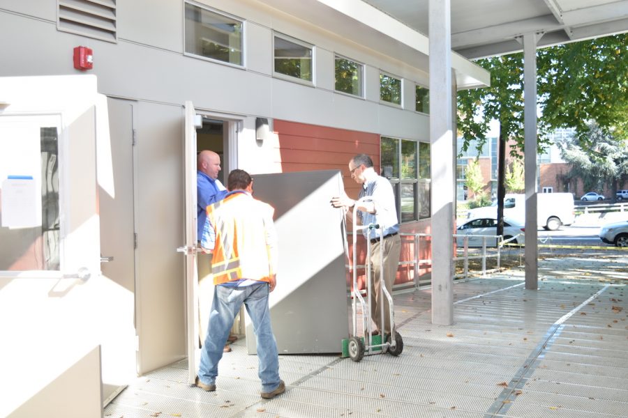 Staff bring furniture into the portables on the day of their opening Sept. 27. By Daniel Lewinsohn
