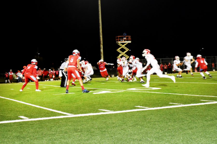 The Lincoln football team plays against Madison last October.