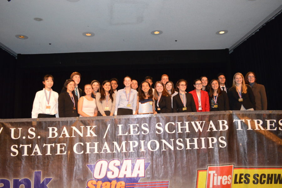 The+speech+and+debate+team+celebrates+its+state+championship+April+22.