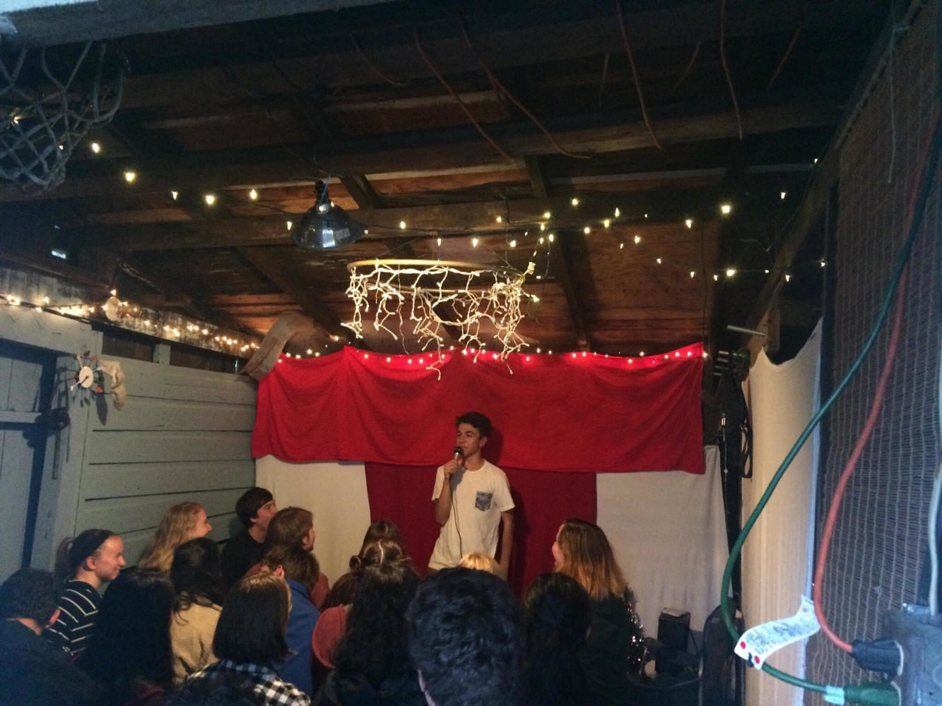 Senior Teis Jayswal performs a comedy act in his garage during Comedy Copper club, which he founded with several other seniors.
