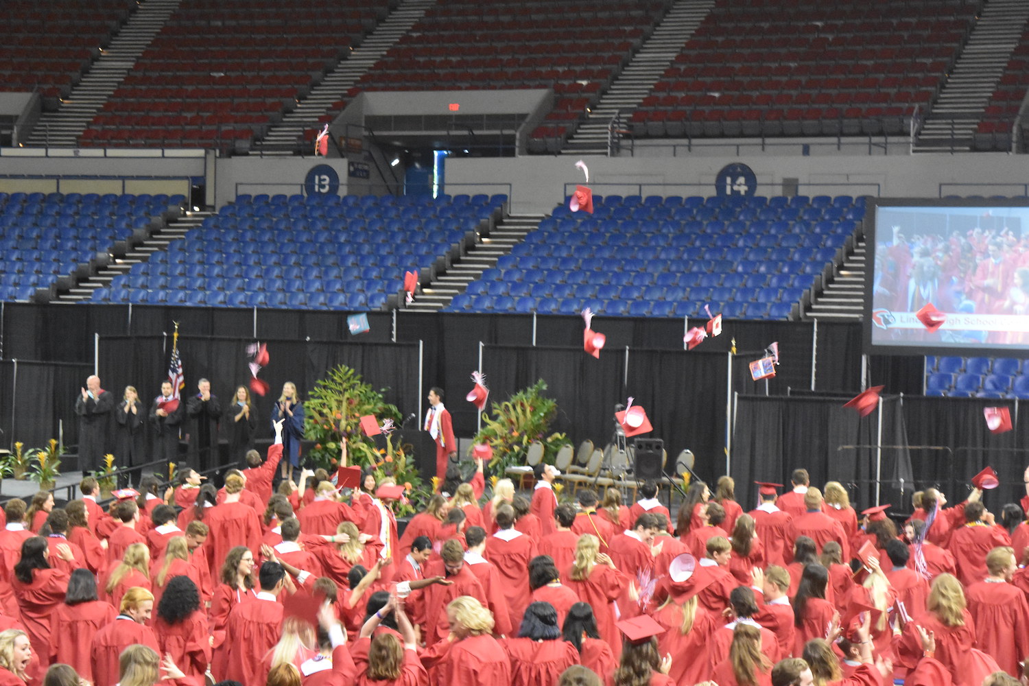 Members of the Class of 2017 throw their caps into the air at their commencement ceremony June 4.