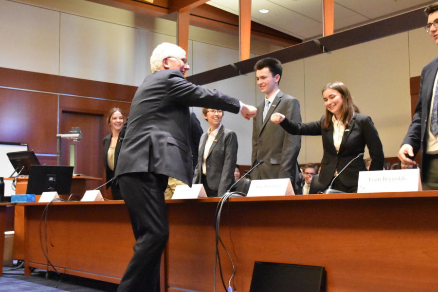 One of the judges (left) at the We the People state competition fist bumps sophomore Anna Rosenberg

after the Unit Six hearing. Lincoln placed second in the state.