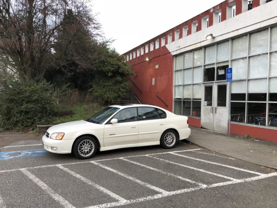 A car without a
permit sits parked
in a handicap spot
outside of the cafeteria. According to PPS district
policy, all handicap
spots on campus
are designated for
staff with handicap passes and visitors, not students
with a disability.