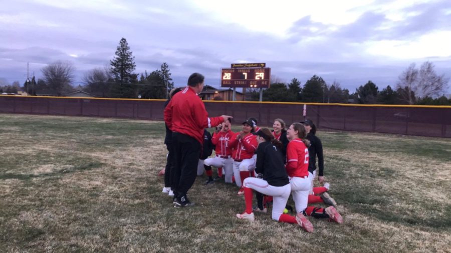 The softball team celebrates after a 29-28 comeback win over Summit High School during a
tournament in Bend. The team is ranked 29th in the state.