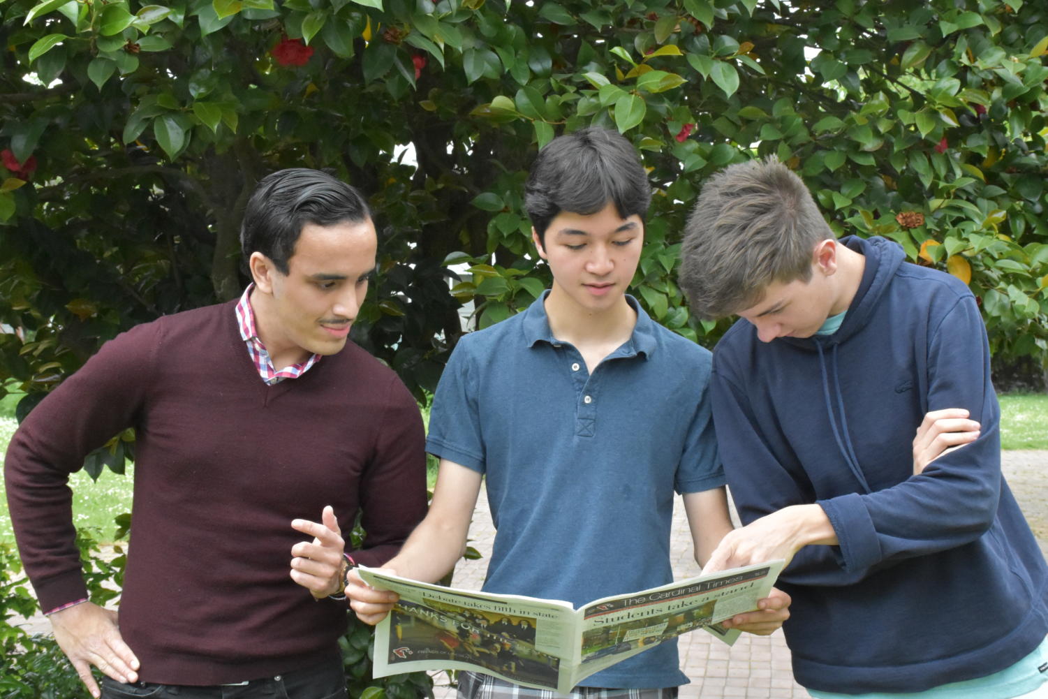 Seniors Ben Pahl (right), Jamie Bikales
(center) and Armand Yazdani (left) say goodbye to the
Cardinal Times as they all head off to college in
the fall.