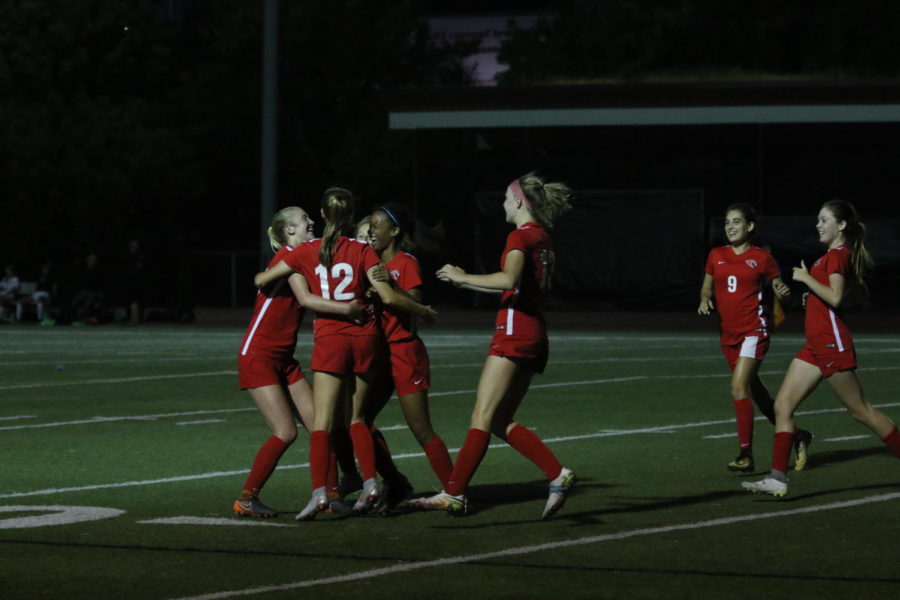 Girls varsity soccer team celebrates sophomore Jolie Maycumber’s (number 12) game winning goal against South Eugene on Aug. 30 2018.
