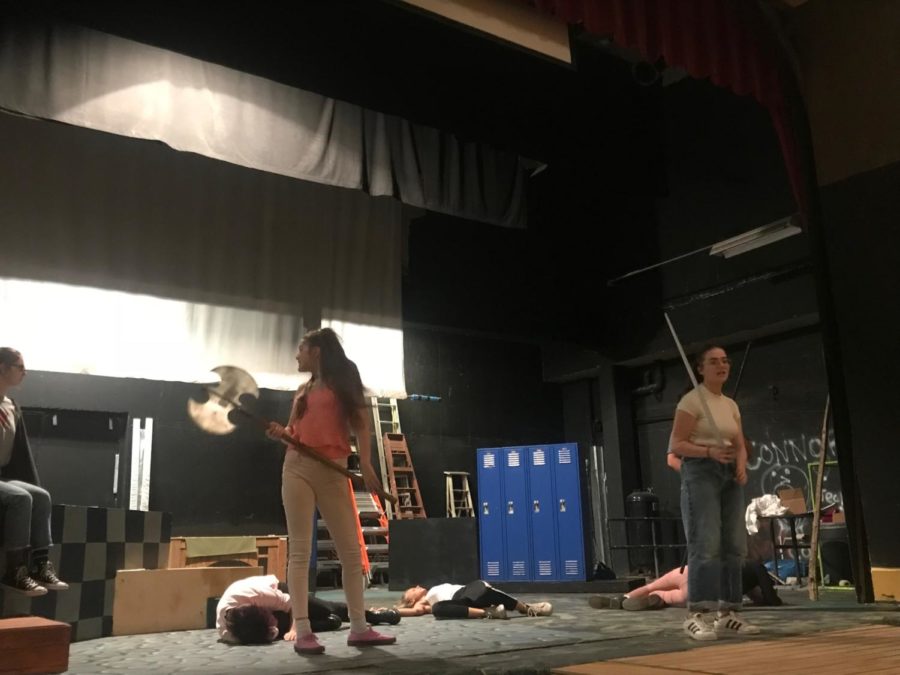 Students rehearse for “She Kills Monsters,” a science fiction story about how a young girl attempts to reconnect with her sister through the game Dungeons
and Dragons.