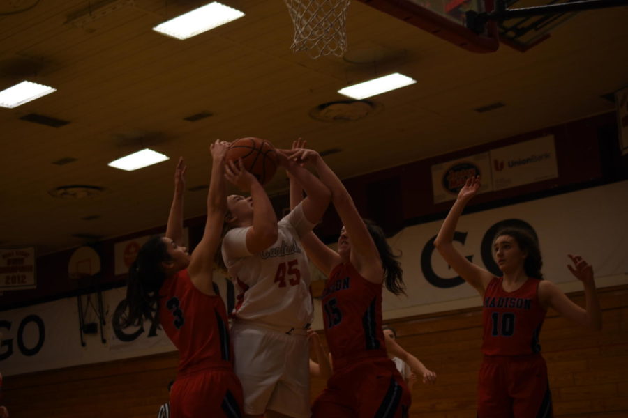 Charlotte Anderson drives to the basket during a Jan. 23 home game vs Madison. This is Anderson’s
seventh season as a varsity athlete, her eighth and final season coming this spring during track and
field.