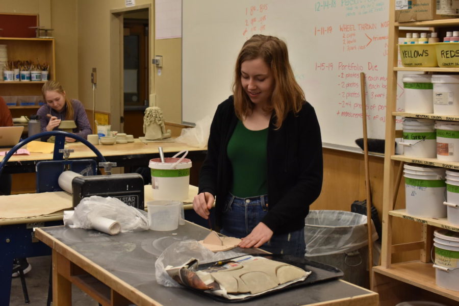 Evie Babbie, Vice President of Lincoln’s NAHS chapter, works on an art project in ceramics.