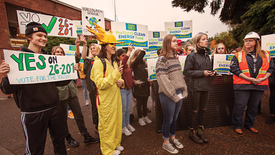 From left to right: Senior Wyatt Jenkerson, senior Carmen Vintro, senior Hailey Fisher, and senior Bella Klosterman at the Environmental Justice Club Oct. 31 rally in support of the Portland Clean Energy Initiative. Klosterman and Vintro started the club this year and have taken leadership positions.  