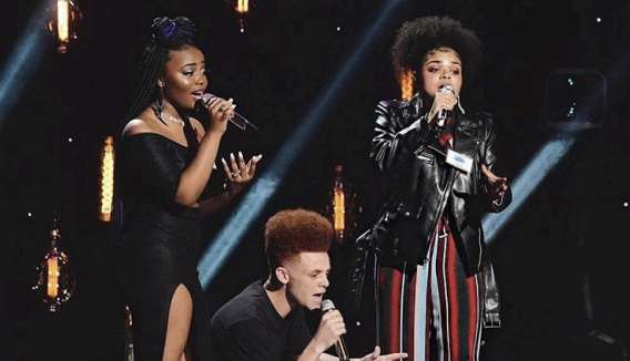 Charlotte Odusanya, with two other American Idol
participants, perform in front of the judges in
Hollywood.