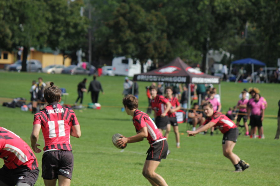 The Lincoln rugby team works their way up the field against Eastside Tsunami Pink. They won the
game 33-0 on Sept. 28, 2019.