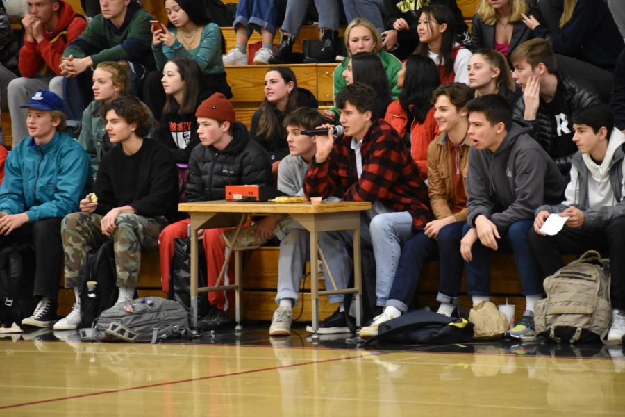 Senior Jake Berry MCs a Hoopfest game while a crowd watches from the bleachers. On Dec. 16,
the Redeem Team and No Name team got into a fight, making spectators question whether stricter
regulations should be set at Hoopfest.