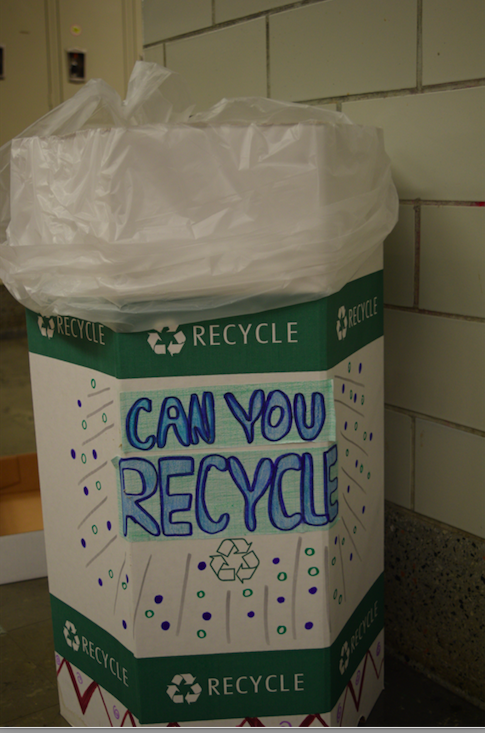 A+decorated+recycling+bin+is+located+inside+senior+hall.+Many+of+these+bins+are+spread+out+across+the+school+to+promote+sustainability.
