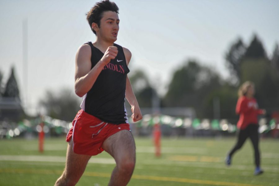 Senior Ethan Harper runs a 400 meter dash at Wilson during his junior year.