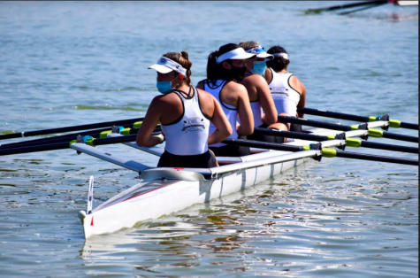 Zoe Scogna, sitting second closest to the back, races with three rowing partners at the rowing National Championship. 