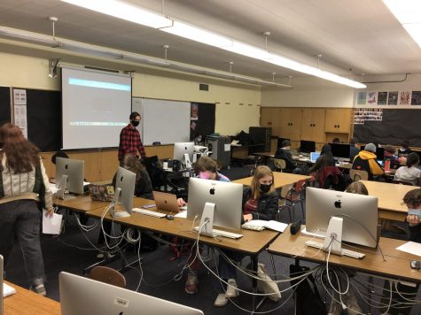 IB Film teacher Jordan Sudermann teaches his class of first year students, as his second year students work on long-term projects.
