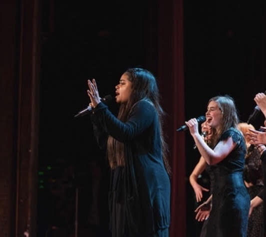  Vivace alum Charlotte Odusanya and Abbey Russell perform with the rest of the a capella group in 2018. Vivace is a student-led music group that was created 12 years ago to support Lincoln students' love for singing and the performing arts.