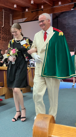 Junior Bailey Armstrong walks arm in arm with Lord High Chamberlain John Jackson. Armstrong was named this year’s Lincoln Rose Princess. She will now represent Lincoln at the Rose Festival and in the greater competition for Rose Queen.