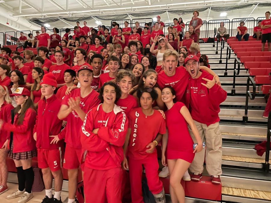 A portion of the senior class poses for a picture at the first Color Competition spirit assembly in the New Nest wearing their traditional color, red. All activities are planned and organized and led by the ASB team and activities director and leadership teacher Lisa Klein-Wolf. The assembly included participants from each class competing in a variety of games like tug of war and limbo.  
