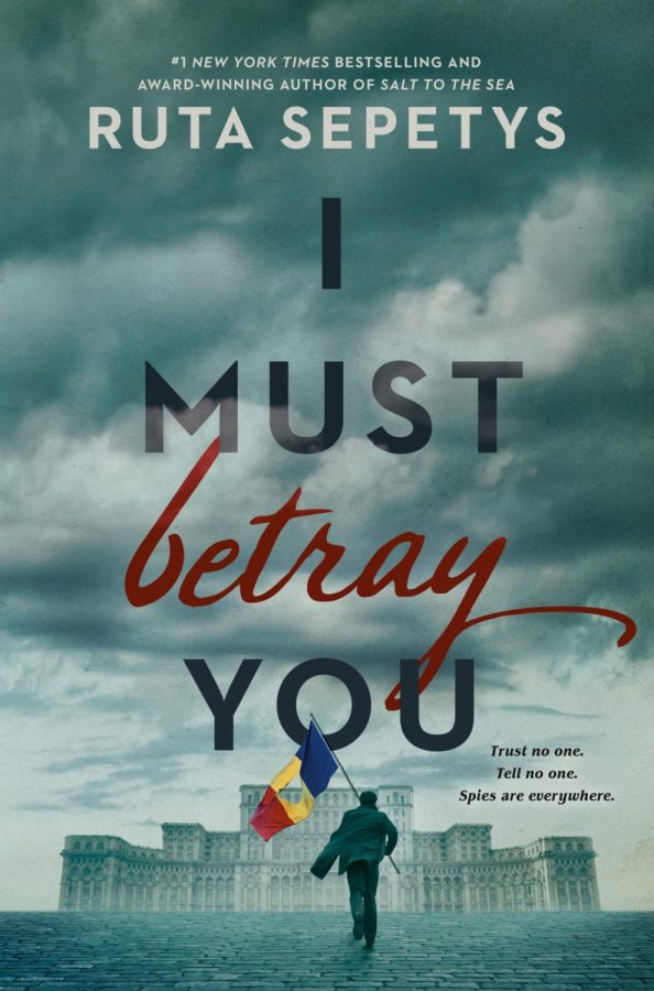 The main character of “I Must Betray You,” Christian holds the Romanian flag with a hole cut out of the center in defiance of the communist regime. Without the crest the flag of Romania is the same as it was before the Socialist Republic of Romania.