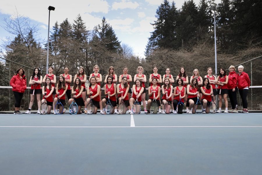  The girls varsity tennis team for the 2023 spring season. Instead of having a separate junior varsity team, the players have been combined to form a larger varsity team.
