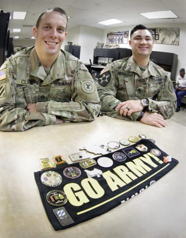 Army representatives publicly recruiting for potential candidates. 
