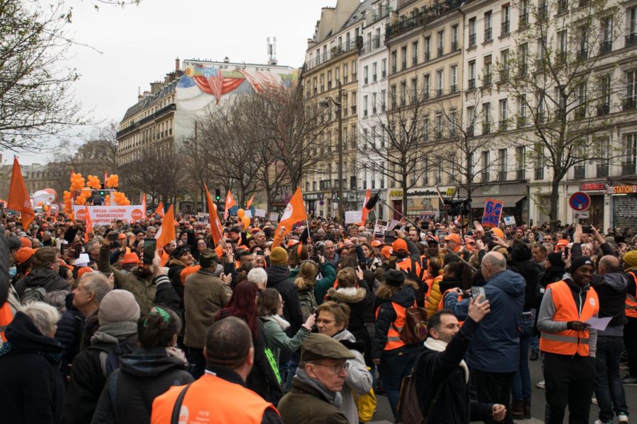 Protesters in Paris wearing the orange vest of the CFDT, a major labor union in France.