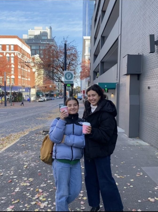 Junior exchange students Elena Schneider and Maria Cowlishaw enjoy Coco Donuts coffee while exploring the city.