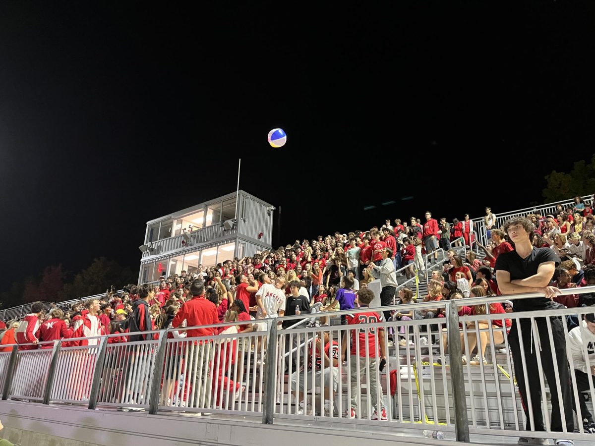 Student section tosses beach ball at homecoming game against Roosevelt.
