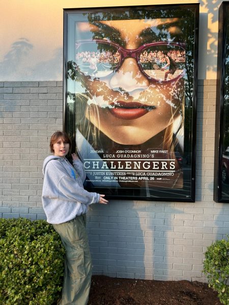 Reporter Isabel Bruce stands in bushes beside the Challengers poster, outside of Century 16 Theatres in Cedar Hills. Bruce was unprepared for what she would experience in the next 2 hours and 11 minutes of her life. 