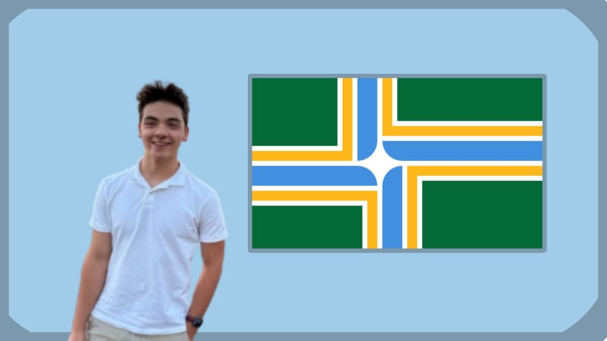 Sophomore Conine Reyes poses with the Portland flag.