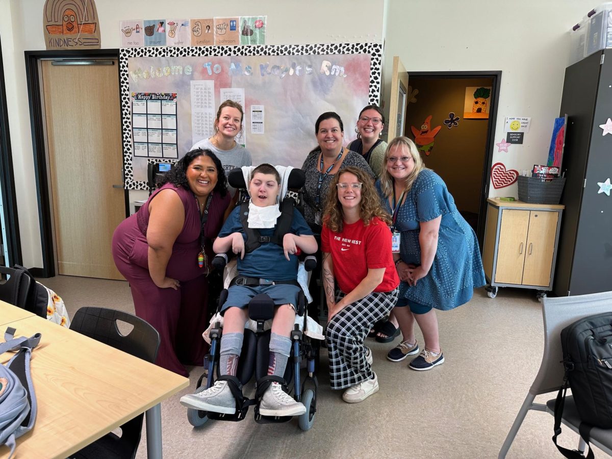 Kyle Davidson and staff in the Intensive Skills Classroom. Davidson’s teacher Kayla Fantz-Sands describes Kyle as a bubbly, determined and talkative person. 

Courtesy of Laura Davidson