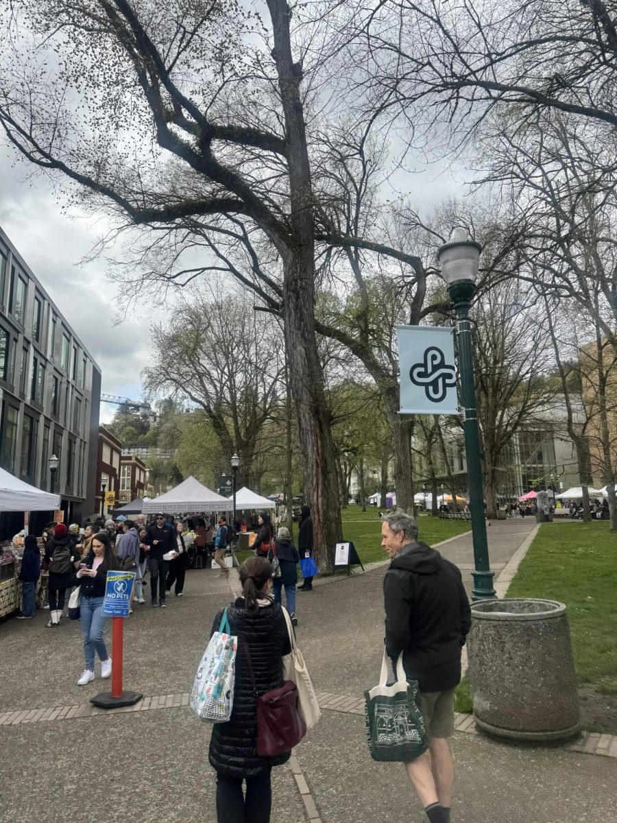 The line of different food vendors on a cloudy Saturday at the PSU Farmers Market.