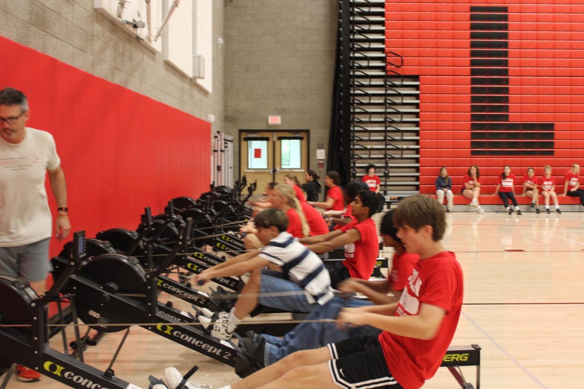 Physical education students do their four-minute rowing test, which is not required by the Presidential Fitness Test, but incorporated into the Lincoln curriculum. Photo by Seth Kugel. 
