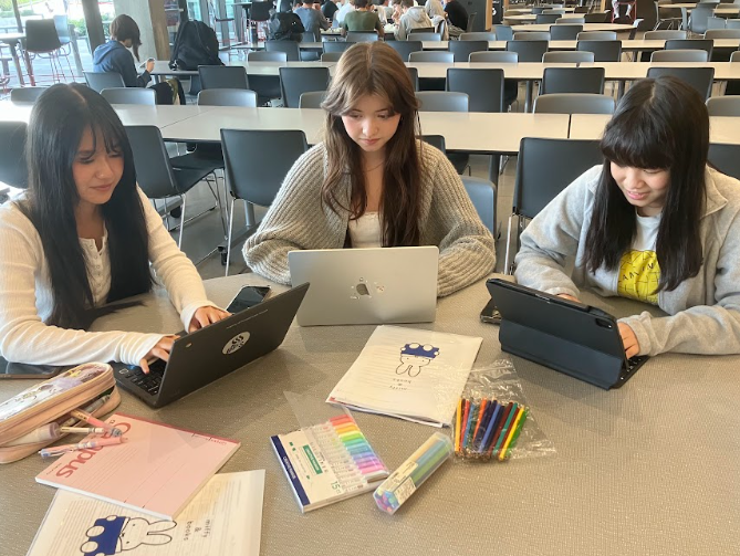  Founders of NCHS hard at work. Left to right: Allison Hu, Anika Rigby, Cheryl Hung. By Sirena Chen