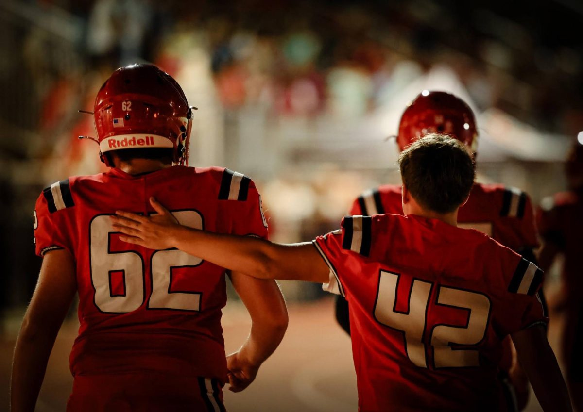 The Lincoln Cardinals extend their winning streak, marking their best season start in ten years. A moment of encouragement between teammates captures the teamwork and camaraderie behind their success.
Courtesy of Sarah Quist