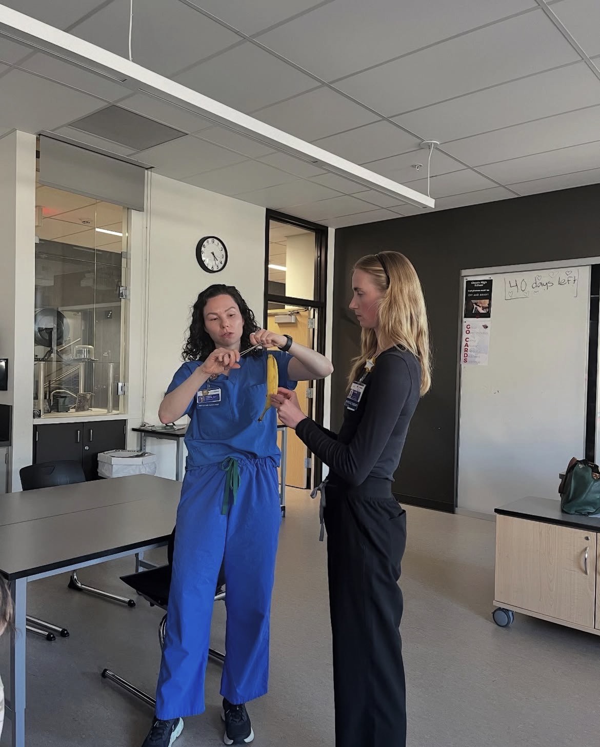 A guest speaker shows members how to suture a banana. Courtesy of Artina Bojnordi
