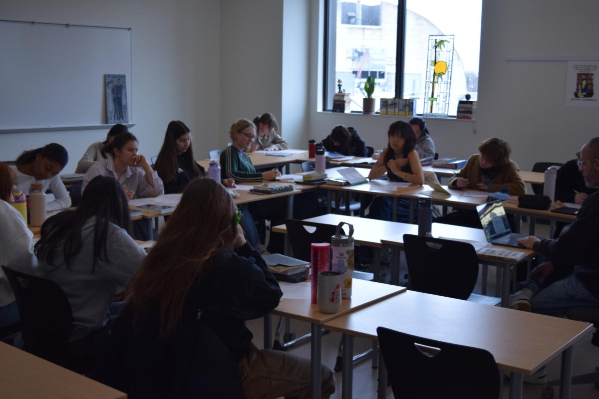 Sophomores in Mr. Gutlerner’s English 3-4 class write paragraphs by hand.